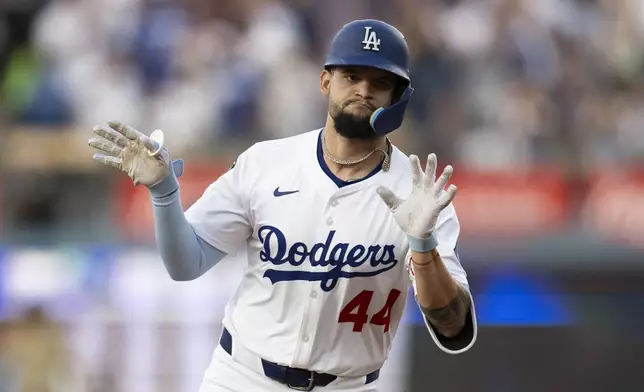 Los Angeles Dodgers' Andy Pages rounds the bases after hitting a solo homer during the second inning of a baseball game against the San Diego Padres in Los Angeles, Tuesday, June 17, 2025. (AP Photo/Kyusung Gong)