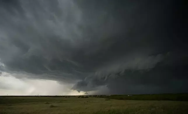 An approaching storm with a shelf cloud and rain shaft is visible during a Project ICECHIP operation on Tuesday, June 3, 2025, in Scotland, Texas. (AP Photo/Carolyn Kaster)