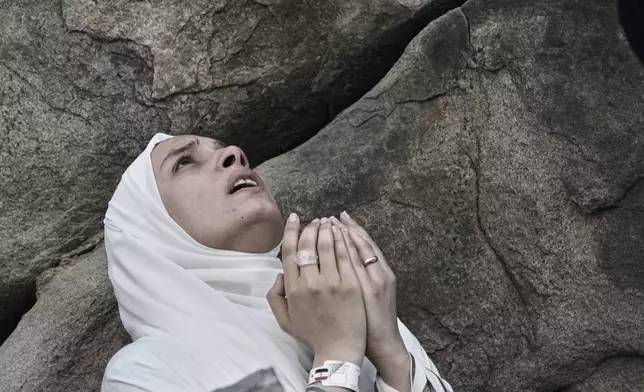 A Muslim pilgrim prays during the annual Hajj pilgrimage on the Plain of Arafat, near the holy city of Mecca, Saudi Arabia, Thursday, June 5, 2025. (AP Photo/Amr Nabil)