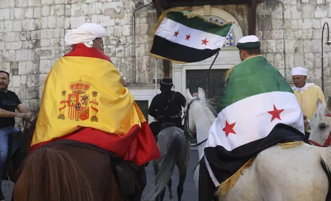 Pilgrims, including three from Spain, visit the Umayyad Mosque during a months-long horseback journey from Spain to Saudi Arabia to perform the Hajj, in Damascus, Syria, April 21, 2025. (AP Photo/Omar Albam)
