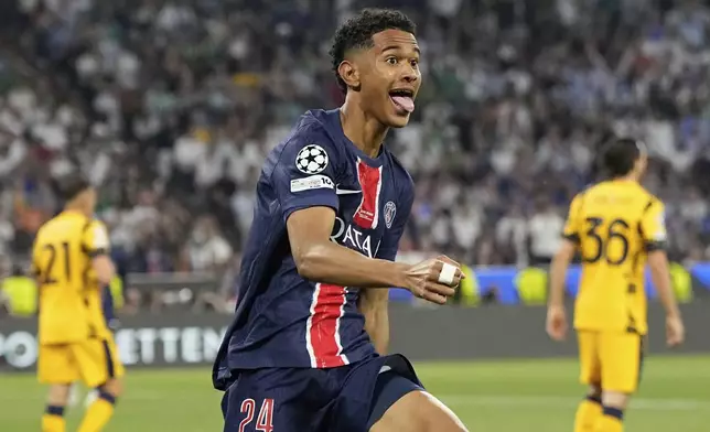 PSG's Senny Mayulu celebrates after scoring his side's fifth goal during the Champions League final soccer match between Paris Saint-Germain and Inter Milan at the Allianz Arena in Munich, Germany, Saturday, May 31, 2025. (AP Photo/Martin Meissner)