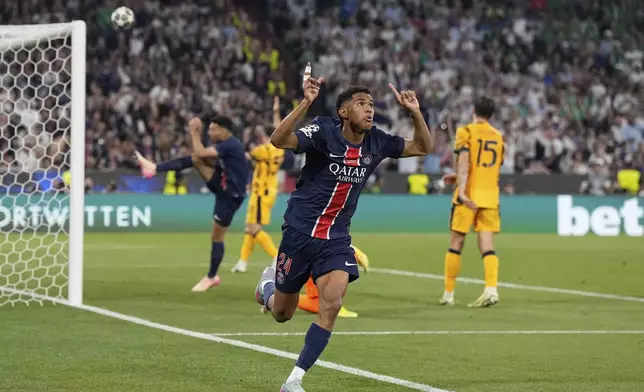 PSG's Senny Mayulu celebrates after scoring his side's fifth goal during the Champions League final soccer match between Paris Saint-Germain and Inter Milan at the Allianz Arena in Munich, Germany, Saturday, May 31, 2025. (AP Photo/Martin Meissner)