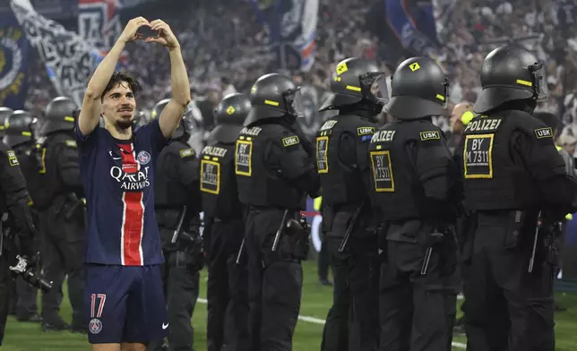 PSG's Vitinha celebrates after the Champions League final soccer match between Paris Saint-Germain and Inter Milan at the Allianz Arena in Munich, Germany, Saturday, May 31, 2025. (AP Photo/Alexandra Beier)