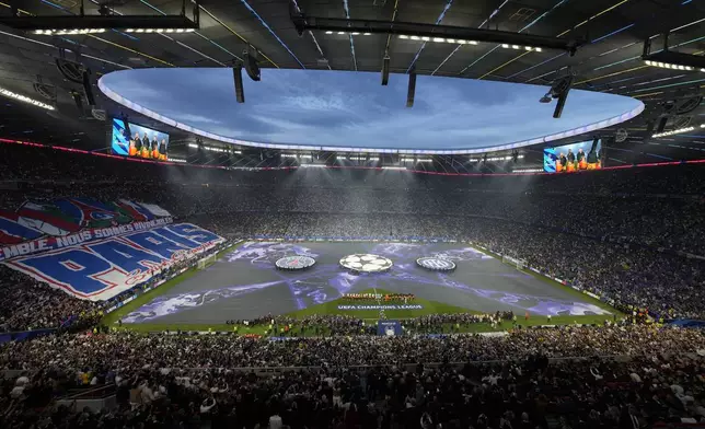Starting players pose for a team photo at the beginning of the Champions League final soccer match between Paris Saint-Germain and Inter Milan at the Allianz Arena in Munich, Germany, Saturday, May 31, 2025. (AP Photo/Michael Probst)