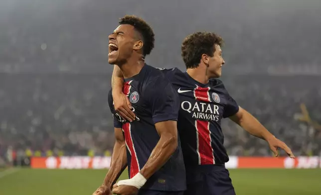 PSG's Desire Doue celebrates after scoring his side's second goal during the Champions League final soccer match between Paris Saint-Germain and Inter Milan at the Allianz Arena in Munich, Germany, Saturday, May 31, 2025. (AP Photo/Matthias Schrader)
