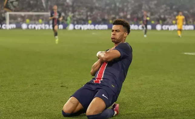 PSG's Desire Doue celebrates after scoring his side's second goal during the Champions League final soccer match between Paris Saint-Germain and Inter Milan at the Allianz Arena in Munich, Germany, Saturday, May 31, 2025. (AP Photo/Matthias Schrader)