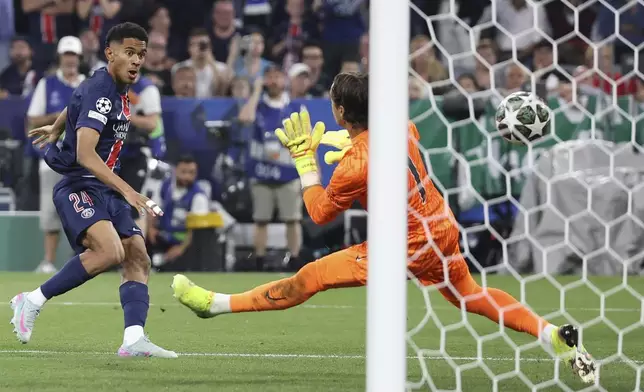 PSG's Senny Mayulu scores his side's fifth goal during the Champions League final soccer match between Paris Saint-Germain and Inter Milan at the Allianz Arena in Munich, Germany, Saturday, May 31, 2025. (AP Photo/Alexandra Beier)
