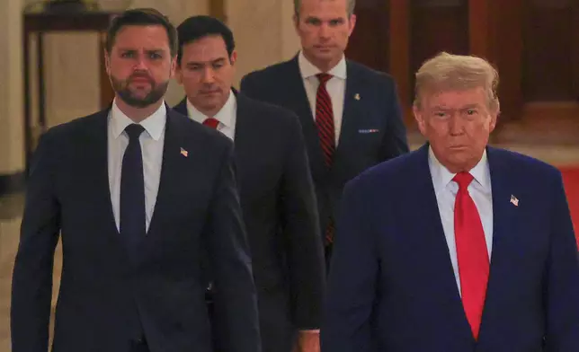 President Donald Trump arrives with Vice President JD Vance, Secretary of State Marco Rubio and Defense Secretary Pete Hegseth to speak from the East Room of the White House in Washington, Saturday, June 21, 2025, after the U.S. military struck three Iranian nuclear and military sites, directly joining Israel's effort to decapitate the country's nuclear program. (Carlos Barria/Pool via AP)