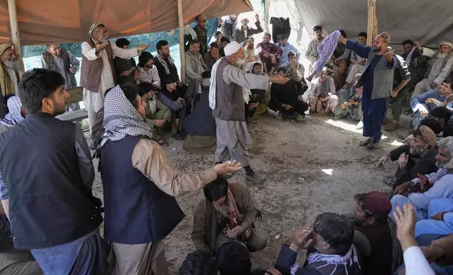 Afghan men argue after a bloody cockfight at a cockfighting venue in Kabul, Afghanistan, Friday, May 30, 2025. (AP Photo/Ebrahim Noroozi)