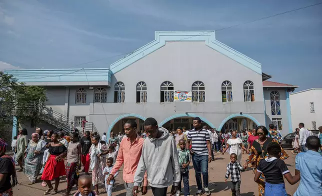 People leave following a mass service in honour of Floribert Bwana Chui Bin Kositi, at a catholic church in Goma, Democratic Republic of Congo, Sunday June 15, 2025. (AP Photo/Moses Sawasawa)