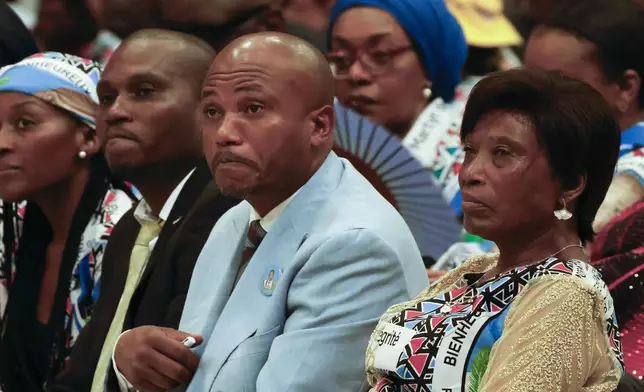 From right, Gertrude Kamara Ntawiha, mother of Floribert Bwana Chui Bin Kositi, a Congolese man killed in 2007 for fighting corruption, and his brothers Jean-Claude, center, and Tresor, attend a ceremony for his beatification in St. Paul Outside the Walls' Basilica, in Rome, Sunday, June 15, 2025. (AP Photo/Riccardo De Luca)