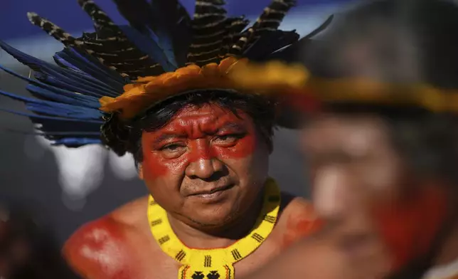An Indigenous man protests against the auction of dozens of oil blocks, including blocks near the mouth of the Amazon River, in Rio de Janeiro, Tuesday, June 17, 2025. (AP Photo/Silvia Izquierdo