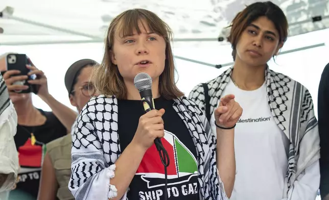 Climate activist Greta Thunberg with other activists from a human rights organization meets with journalists in Catania, Italy, Sunday, June 1, 2025, ahead of their departure for the Mideast. (AP Photo/Salvatore Cavalli)