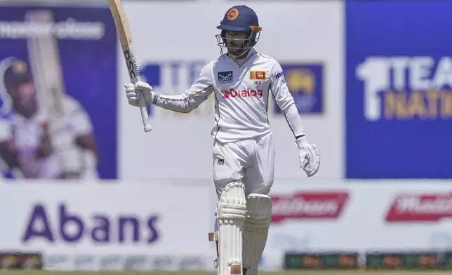 Sri Lanka's Pathum Nissanka celebrates his fifty runs during day three of the first cricket test match between Sri Lanka and Bangladesh in Galle, Sri Lanka, Thursday, June 19, 2025. (AP Photo/Eranga Jayawardena)