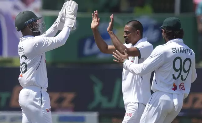 Bangladesh's Taijul Islam, second left, celebrates the wicket of Sri Lanka's Lahiru Udara during day three of the first cricket test match between Sri Lanka and Bangladesh in Galle, Sri Lanka, Thursday, June 19, 2025. (AP Photo/Eranga Jayawardena)