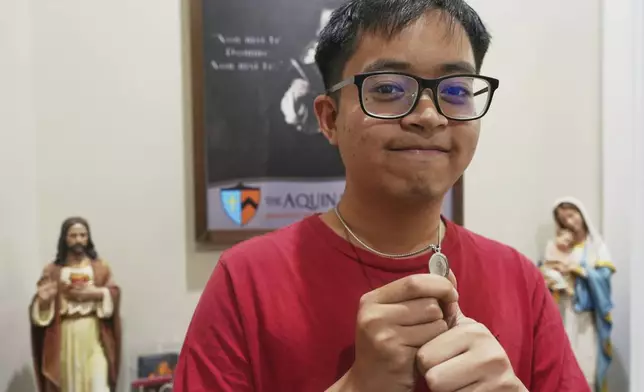 Princeton University alumnus Ace Acuna stands for a portrait at the Aquinas Institute, the university’s Catholic campus ministry, after a Mass at the school's chapel in Princeton, N.J., on Thursday, May 15, 2025. (AP Photo/Luis Andres Henao)