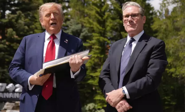 President Donald Trump meets with Britain's Prime Minister Keir Starmer on the sidelines of the G7 Summit, Monday, June 16, 2025, in Kananaskis, Canada. (AP Photo/Mark Schiefelbein)