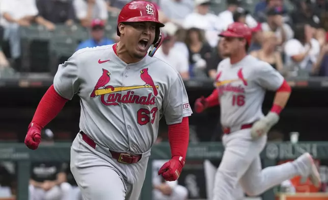St. Louis Cardinals' Yohel Pozo reacts as he runs after hitting a one-run single during the eighth inning in the first baseball game of a doubleheader against the Chicago White Sox, Thursday, June 19, 2025. (AP Photo/Nam Y. Huh)