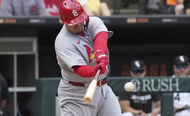St. Louis Cardinals' Yohel Pozo hits a one-run single during the eighth inning in the first baseball game of a doubleheader against the Chicago White Sox, Thursday, June 19, 2025. (AP Photo/Nam Y. Huh)