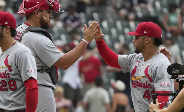 St. Louis Cardinals catcher Iván Herrera, left, celebrates with first baseman Willson Contreras after the Cardinals defeated the Chicago White Sox in the first baseball game of a doubleheader Thursday, June 19, 2025. (AP Photo/Nam Y. Huh)