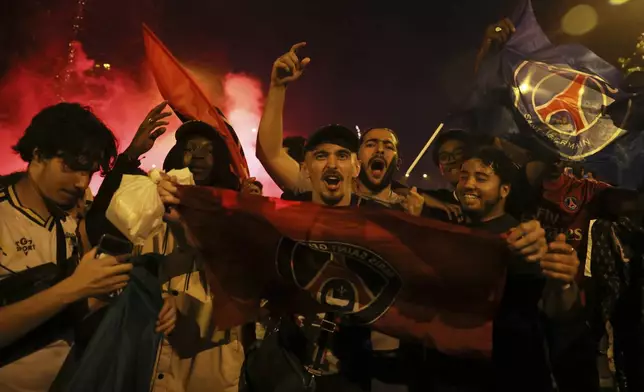 PSG supporters celebrate after the Champions League final soccer match between Paris Saint-Germain and Inter Milan, Sunday, June 1, 2025 in Paris. (AP Photo/Thomas Padilla)
