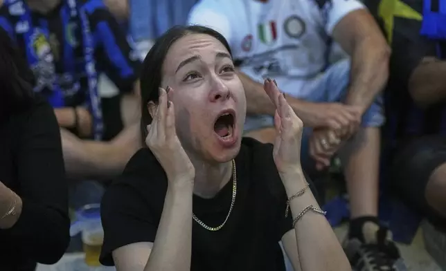 An Inter Milan fan reacts after PSG's Achraf Hakimi scored his side's opening goal during the Champions League final soccer match between Paris Saint-Germain and Inter Milan, in Milan, Italy, Saturday, May 31, 2025. (AP Photo/Antonio Calanni)