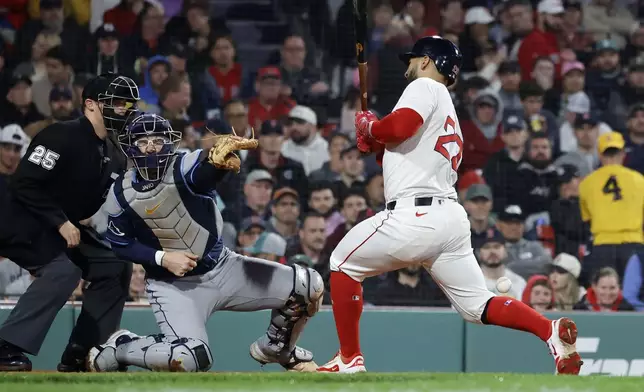 Boston Red Sox's Kristian Campbell (28) reacts after being hit by a pitch as Tampa Bay Rays catcher Danny Jansen (19) looks on during the sixth inning of a baseball game at Fenway Park, Monday, June 9, 2025, in Boston. (AP Photo/Mary Schwalm)