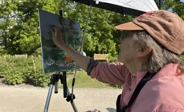 Peonies are on display at Nichols Arboretum's W.E. Upjohn Peony Garden, Monday, June 2, 2025, in Ann Arbor, Mich. (AP Photo/Mike Householder)