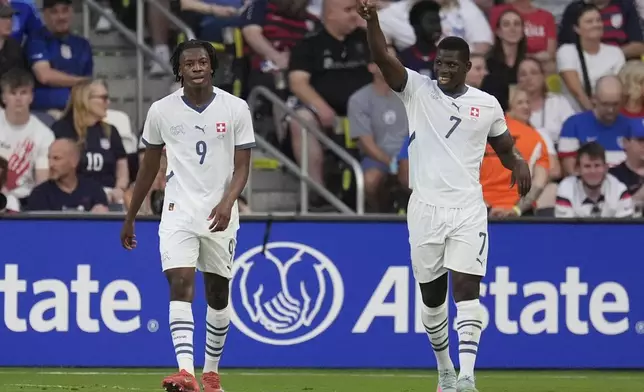 Switzerland forward Breel Embolo (7) celebrates his goal with midfielder Johan Manzanbi (9) during the first half of an international friendly soccer match against the United States, Tuesday, June 10, 2025, in Nashville, Tenn. (AP Photo/George Walker IV)