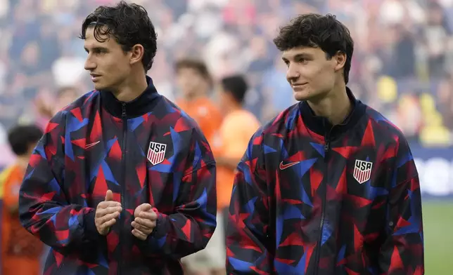 United States midfielder Brenden Aaronson, left, stands with his brother forward Paxten Aaronson before an international friendly soccer match against Switzerland, Tuesday, June 10, 2025, in Nashville, Tenn. (AP Photo/George Walker IV)