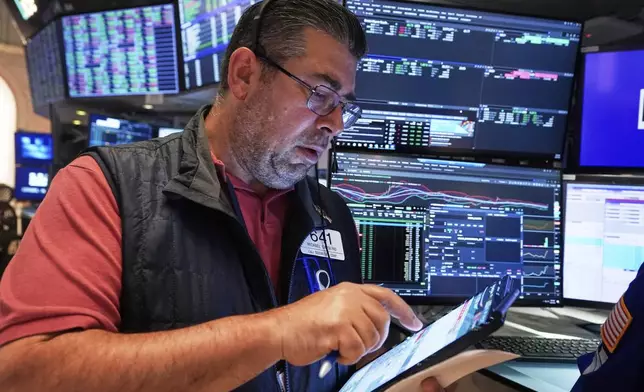 Trader Michael Capolino works on the floor of the New York Stock Exchange, Friday, June 27, 2025. (AP Photo/Richard Drew)