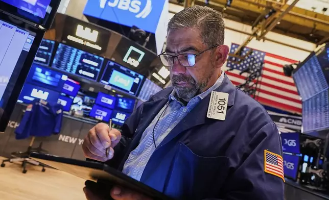 Trader Robert Oswald works on the floor of the New York Stock Exchange, Wednesday, June 25, 2025. (AP Photo/Richard Drew)