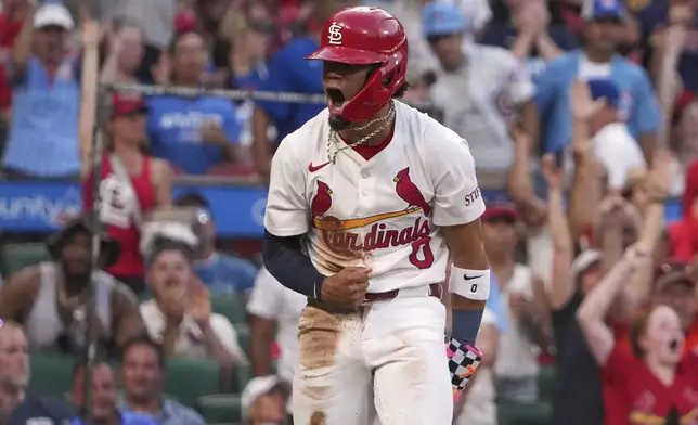 St. Louis Cardinals' Masyn Winn celebrates after scoring from second on a sacrifice fly by Alec Burleson during the fourth inning of a baseball game against the Chicago Cubs Tuesday, June 24, 2025, in St. Louis. (AP Photo/Jeff Roberson)