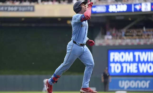 Toronto Blue Jays' Tyler Heineman (55) runs the bases after hitting a solo home run during the second inning of a baseball game against the Minnesota Twins, Saturday, June 7, 2025, in Minneapolis. (AP Photo/Abbie Parr)