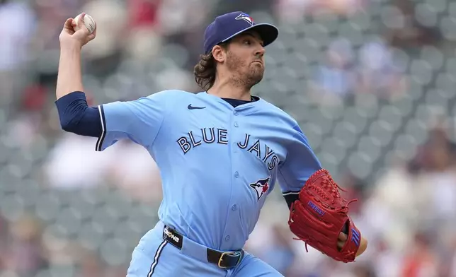 Toronto Blue Jays starting pitcher Kevin Gausman (34) delivers during the third inning of a baseball game against the Minnesota Twins, Saturday, June 7, 2025, in Minneapolis. (AP Photo/Abbie Parr)