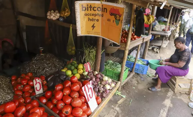 A roadside grocery stall accepts bitcoin payments at Kibera Slums in Nairobi, Kenya, Sunday, May 4, 2025. (AP Photo/Andrew Kasuku)