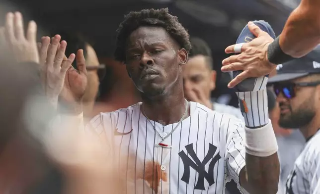 New York Yankees' Jazz Chisholm Jr. reacts in the dugout after scoring on a fielder's choice during the eighth inning of a baseball game against the Baltimore Orioles, Sunday, June 22, 2025, in New York. (AP Photo/Pamela Smith)