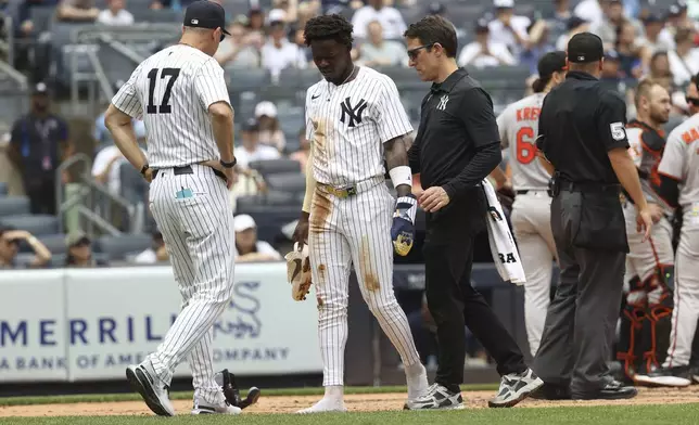 New York Yankees' Jazz Chisholm Jr. walks off the field after colliding with Baltimore Orioles catcher Maverick Handley while scoring during the second inning of a baseball game Sunday, June 22, 2025, in New York. (AP Photo/Pamela Smith)