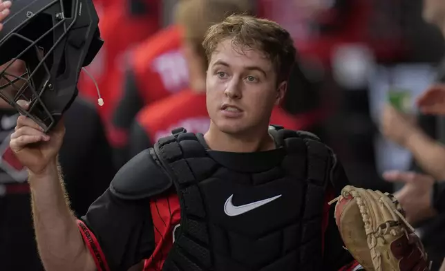 Chicago White Sox catcher Kyle Teel (8) returns to the dugout during the first inning of a baseball game against the Kansas City Royals, Friday, June 6, 2025, in Chicago. (AP Photo/Erin Hooley)
