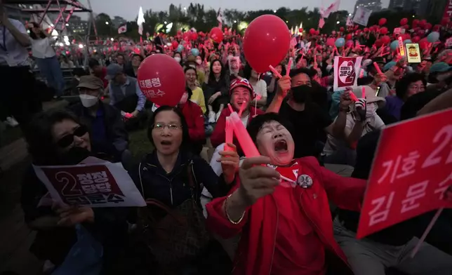 Supporters of Kim Moon Soo, presidential candidate with the People Power Party, attend his election campaign rally in Seoul, South Korea, late Monday, June 2, 2025. (AP Photo/Ahn Young-joon)