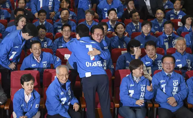 Members of the Democratic Party of Korea watch television coverage of the exit polls for the presidential election at the National Assembly in Seoul, South Korea, Tuesday June 3, 2025. (Jung Yeon-je/Pool via AP)