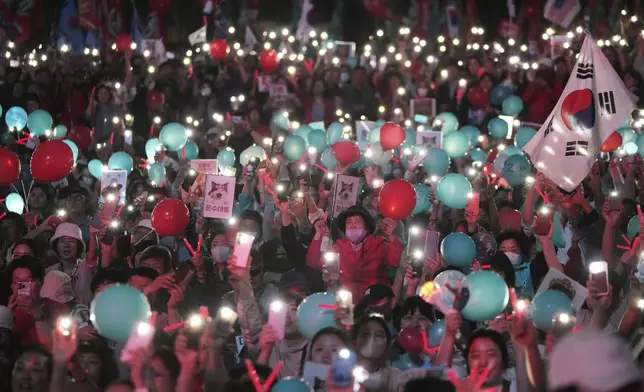 Supporters of Kim Moon Soo, presidential candidate with the People Power Party, attend his election campaign rally in Seoul, South Korea, late Monday, June 2, 2025. (AP Photo/Ahn Young-joon)