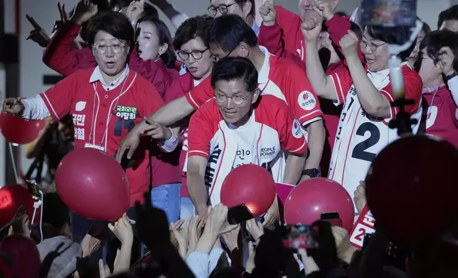 Kim Moon Soo, presidential candidate with the People Power Party's, center, holds a presidential election campaign rally in Seoul, South Korea, late Monday, June 2, 2025. (AP Photo/Ahn Young-joon)