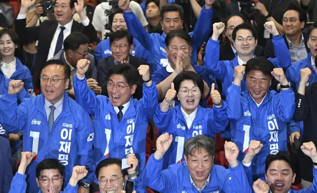 Members of the Democratic Party of Korea watch television coverage of the exit polls for the presidential election at the National Assembly in Seoul, South Korea, Tuesday June 3, 2025. (Jung Yeon-je/Pool via AP)