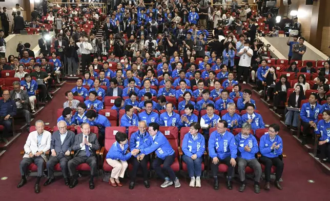 Members of the Democratic Party of Korea watch television coverage of the exit polls for the presidential election at the National Assembly in Seoul, South Korea, Tuesday June 3, 2025. (Jung Yeon-je/Pool via AP)