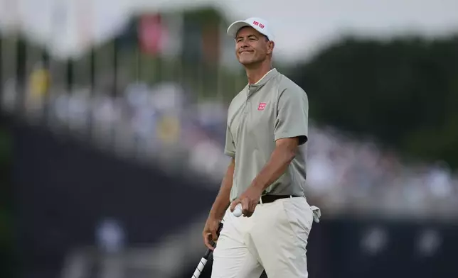 Adam Scott, of Australia, smiles after making a putt on the 16th hole during the third round of the U.S. Open golf tournament at Oakmont Country Club Saturday, June 14, 2025, in Oakmont, Pa. (AP Photo/Carolyn Kaster)