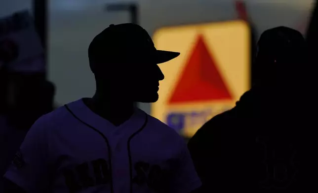 FILE-Fans arrive at Fenway Park in this, Oct. 19, 2021 file photo, in Boston. (AP Photo/Robert F. Bukaty, file)