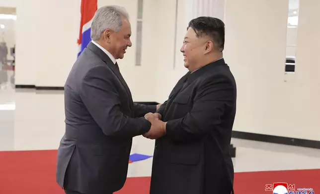 In this photo provided by the North Korean government, North Korean leader Kim Jong Un, right, shakes hands with Russian Security Council Secretary Sergei Shoigu, left, at the headquarters of the ruling Workers' Party in Pyongyang, North Korea, Tuesday, June 17, 2025. Independent journalists were not given access to cover the event depicted in this image distributed by the North Korean government. The content of this image is as provided and cannot be independently verified. Korean language watermark on image as provided by source reads: "KCNA" which is the abbreviation for Korean Central News Agency. (Korean Central News Agency/Korea News Service via AP)