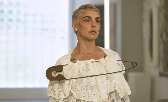 A model wears a creation as part of the men's Simon Cracker Spring-Summer 2026 collection, that was presented in Milan, Italy, Sunday, June 22, 2025. (AP Photo/Luca Bruno)