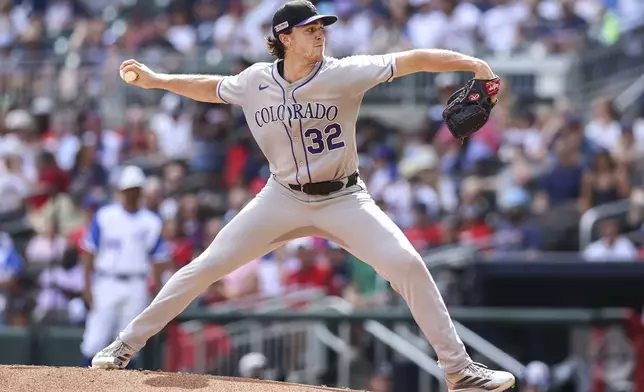 Colorado Rockies pitcher Chase Dollander (32) delivers in the first inning of a baseball game against the Atlanta Braves, Saturday, June 14, 2025, in Atlanta. (AP Photo/Colin Hubbard)